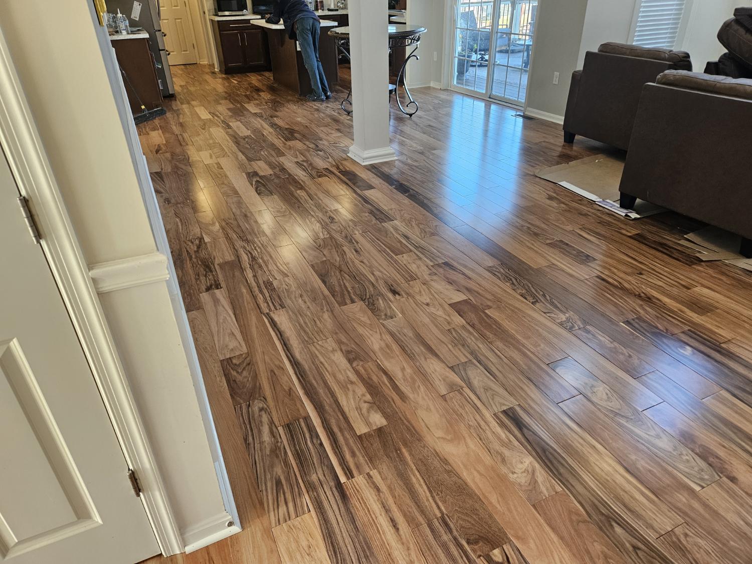 Installed wood-look flooring in living and kitchen area